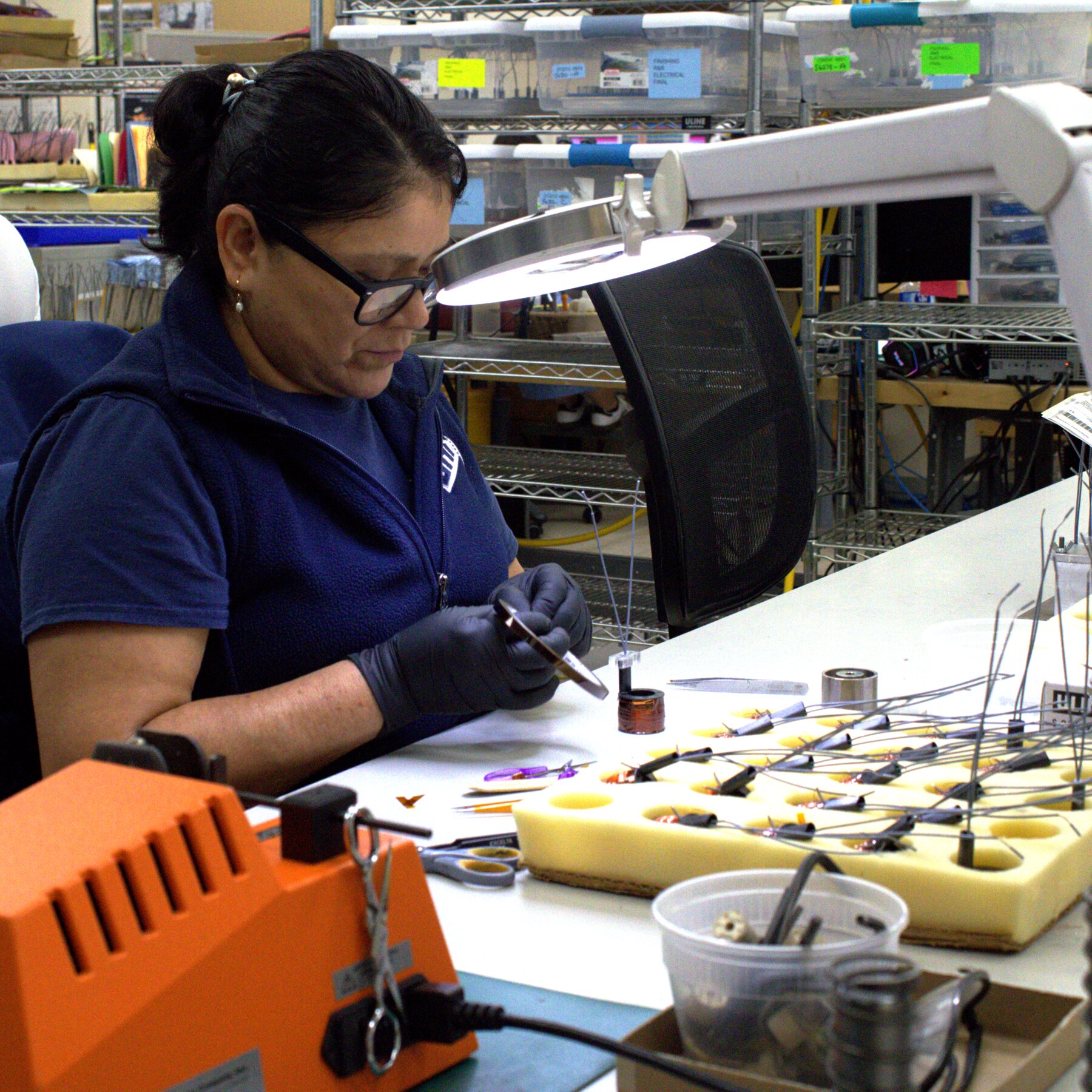 Sag Harbor Industries employee performing precision assembly work